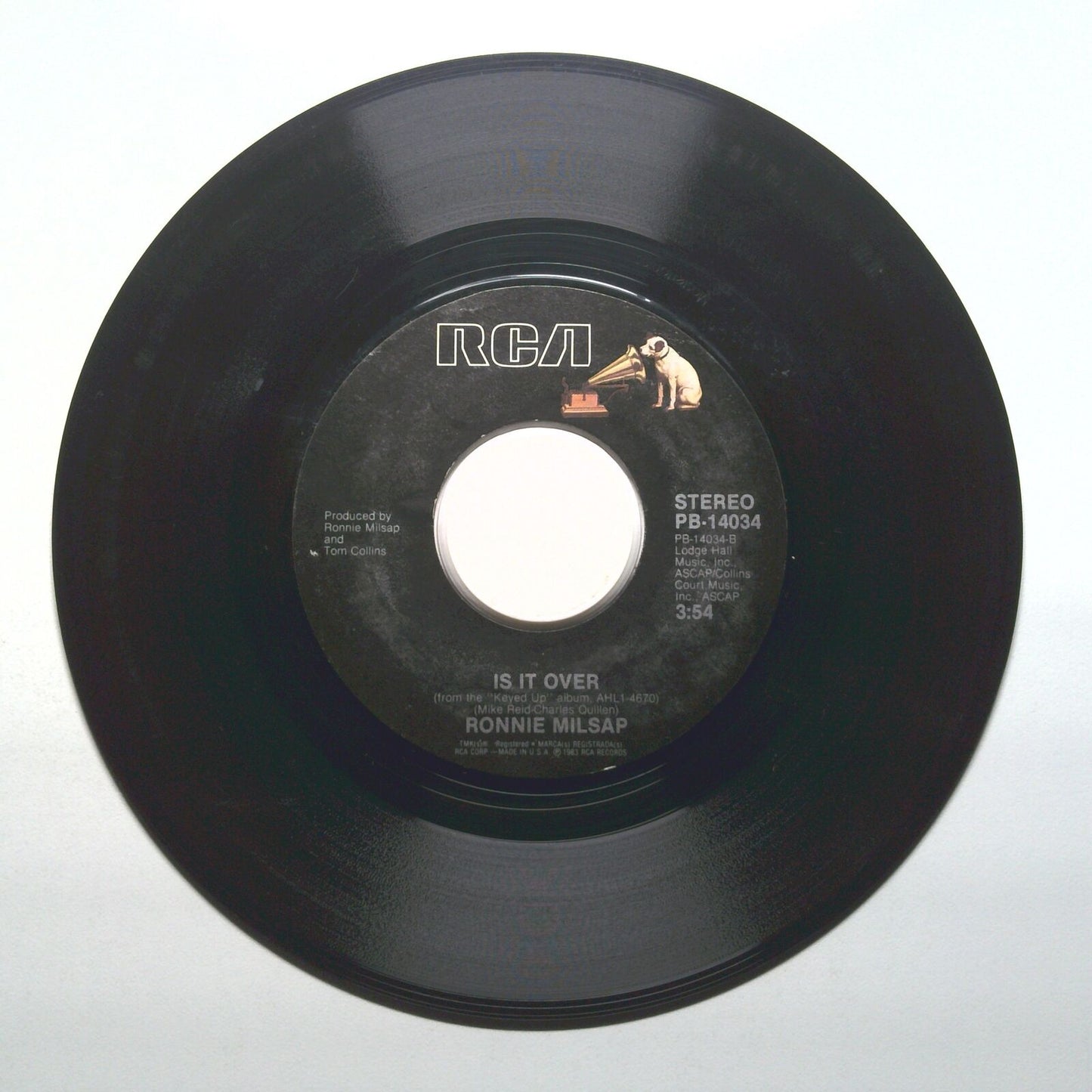 Ronnie Milsap - She Keeps The Home Fires Burning; Is It Over - Vinyl 45 RPM 7"