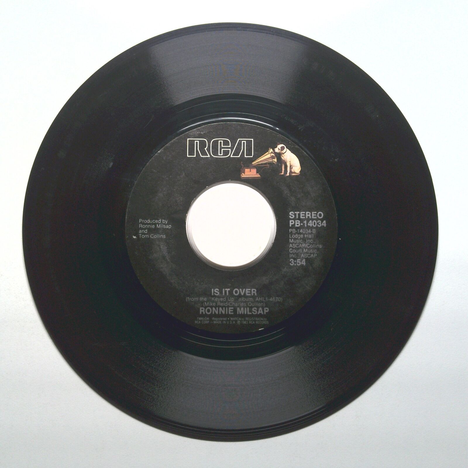 Ronnie Milsap - She Keeps The Home Fires Burning; Is It Over - Vinyl 45 RPM 7"